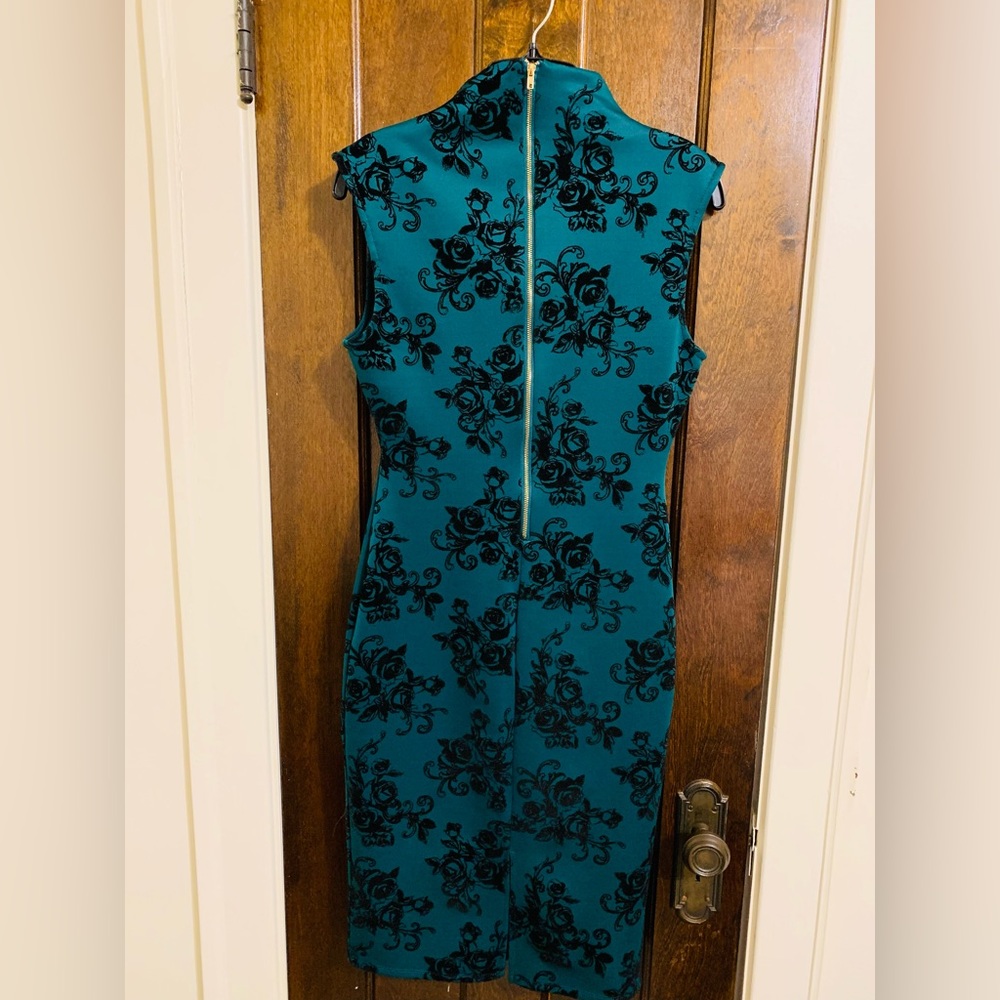 Emerald green & black dress.
